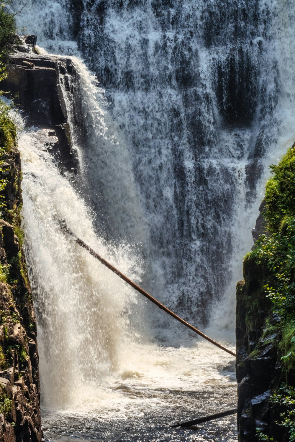 water falls on rocky mountain