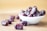 brown round fruit on white ceramic bowl