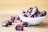 brown round fruit on white ceramic bowl