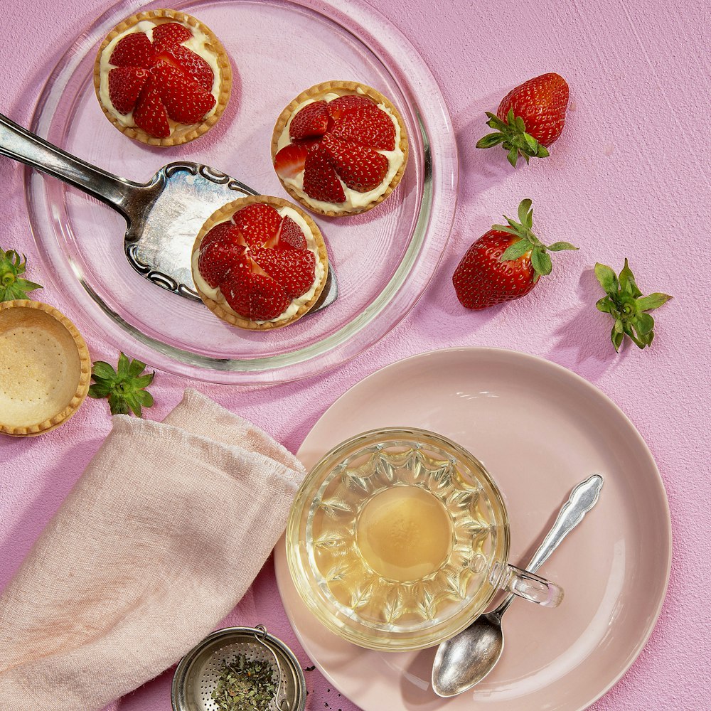 strawberry and lemon on clear glass bowl