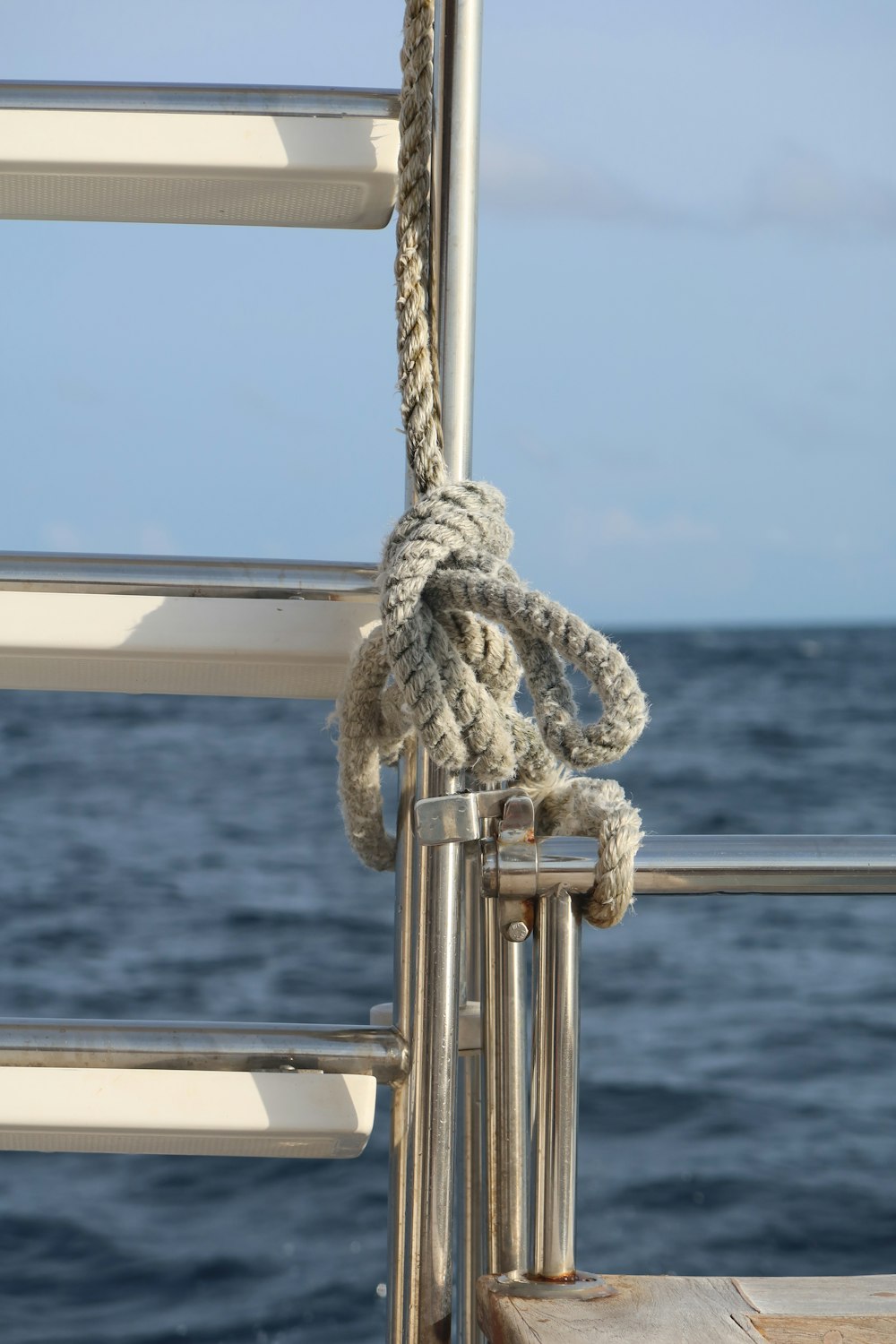 brown rope tied on gray metal bar