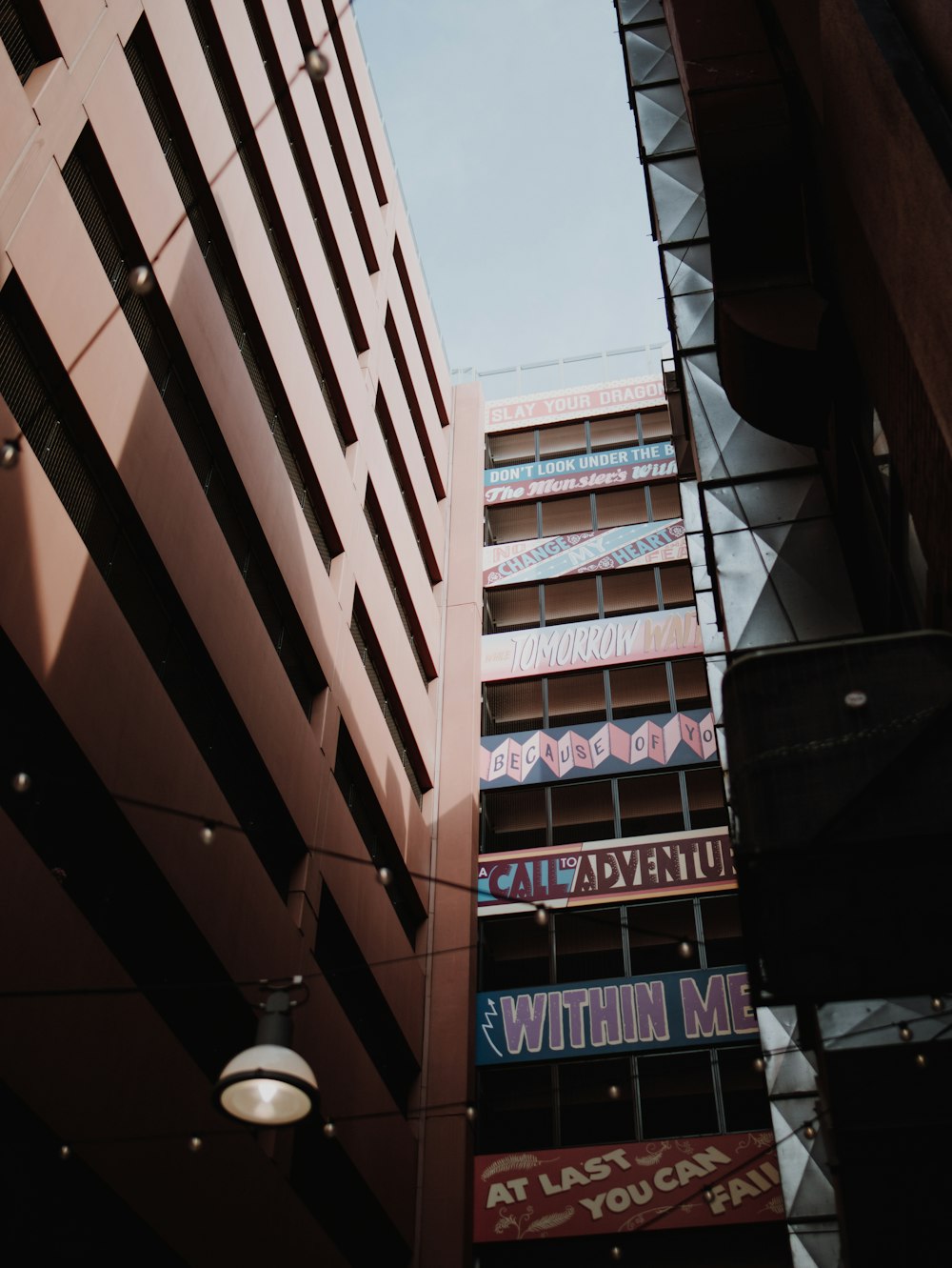 low angle photography of brown concrete building during daytime