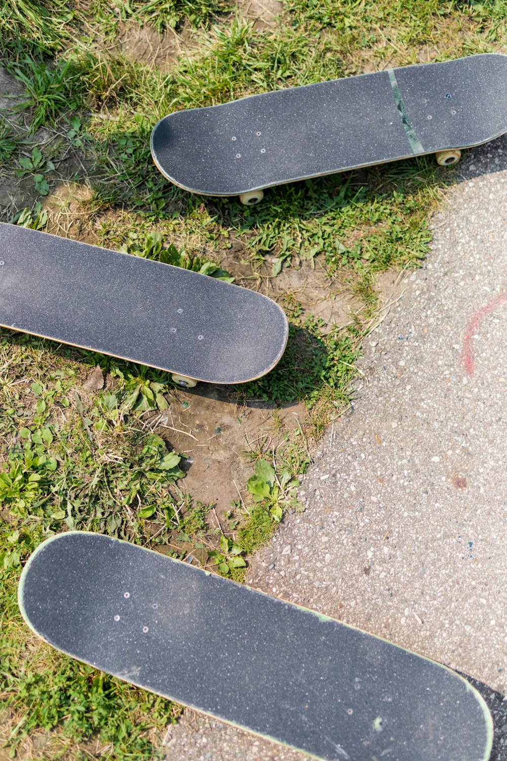 black skateboard on gray concrete floor