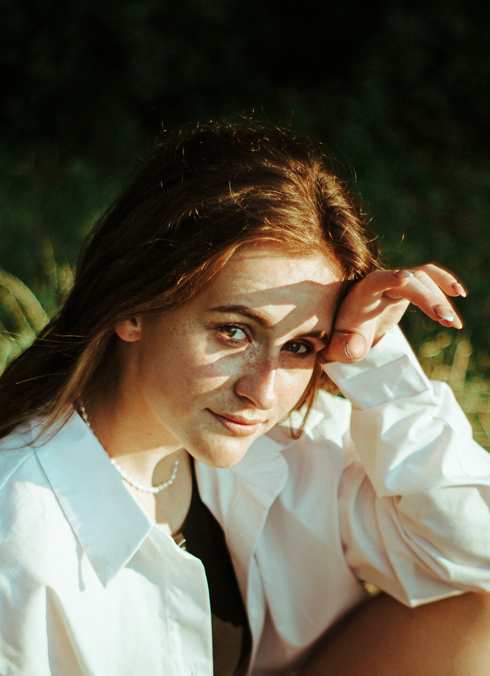 woman in white dress shirt wearing eyeglasses