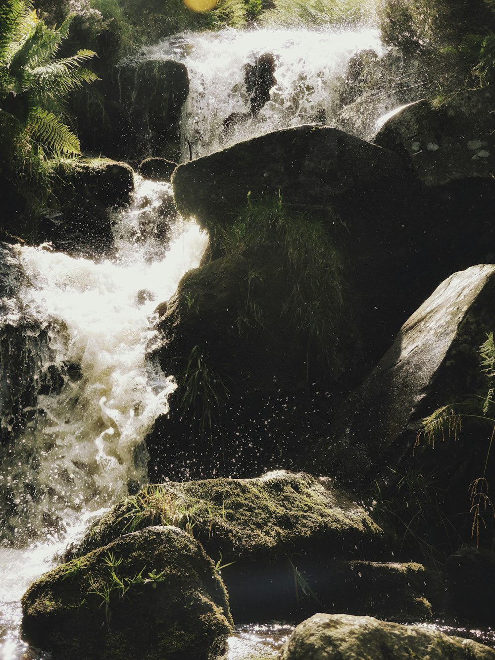 water falls on rocky mountain