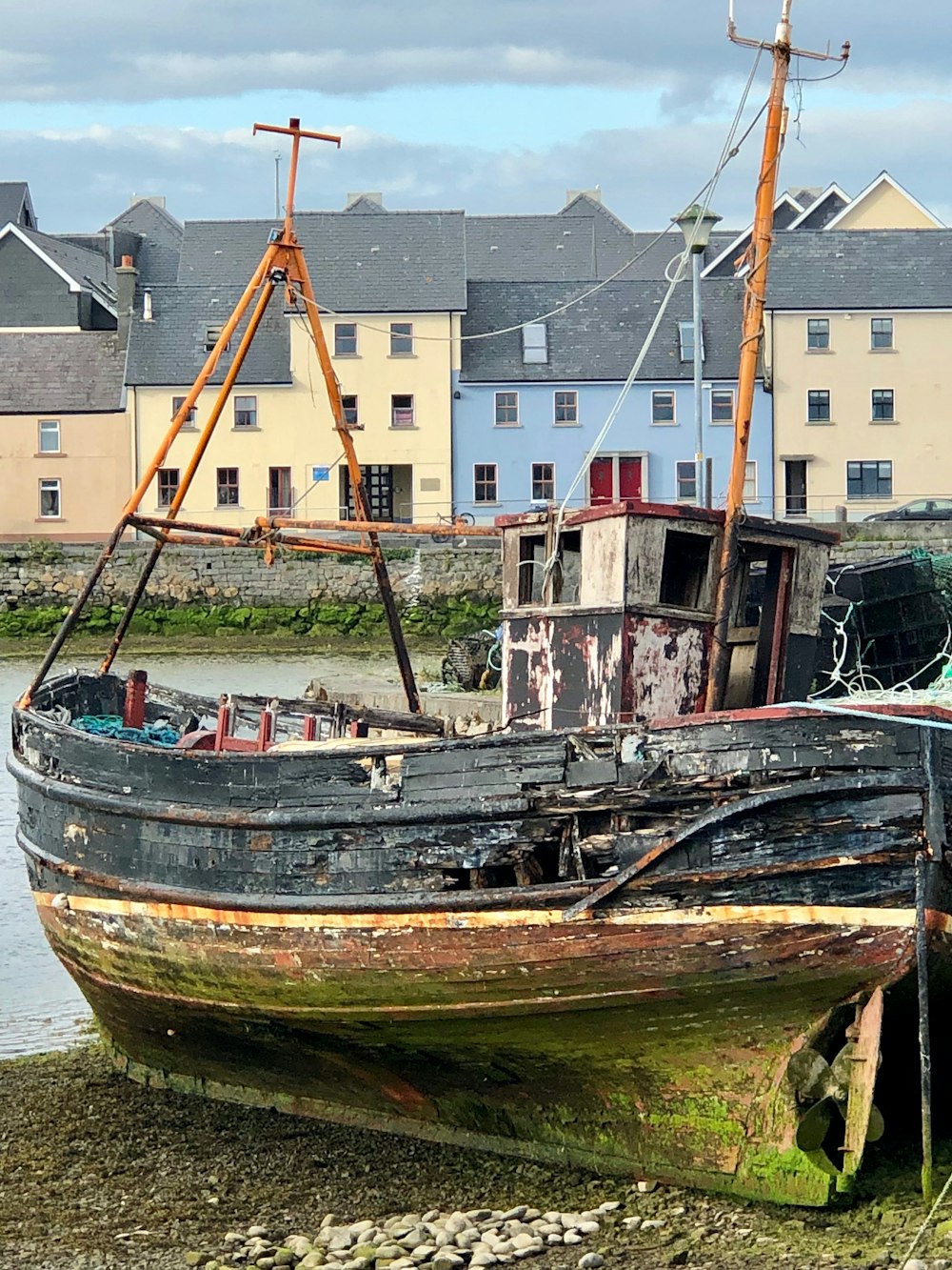 brown and white boat on dock during daytime