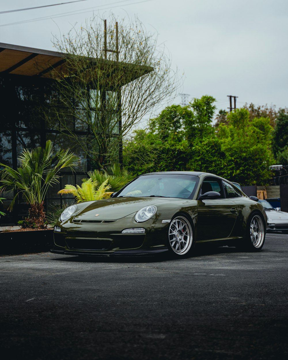 black porsche 911 parked on parking lot during daytime