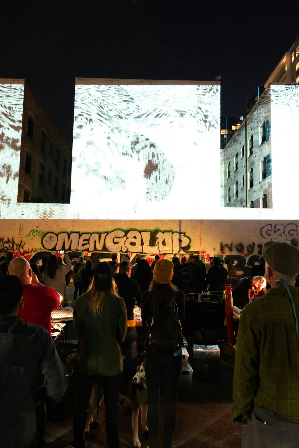 people standing near white concrete building during daytime