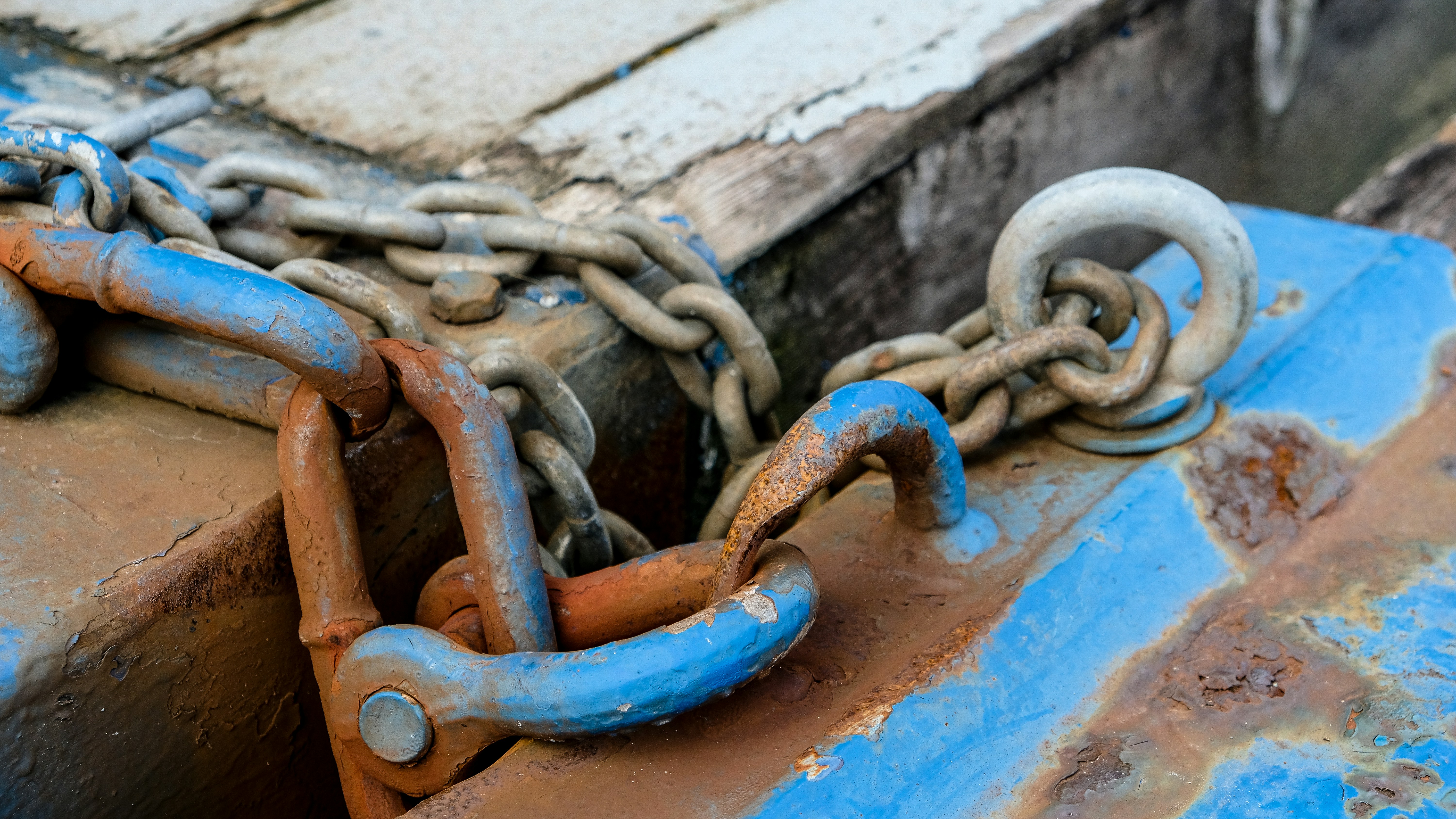of tools and materials for dock anchoring, like chains, shackles, and a concrete block - anchor floating dock