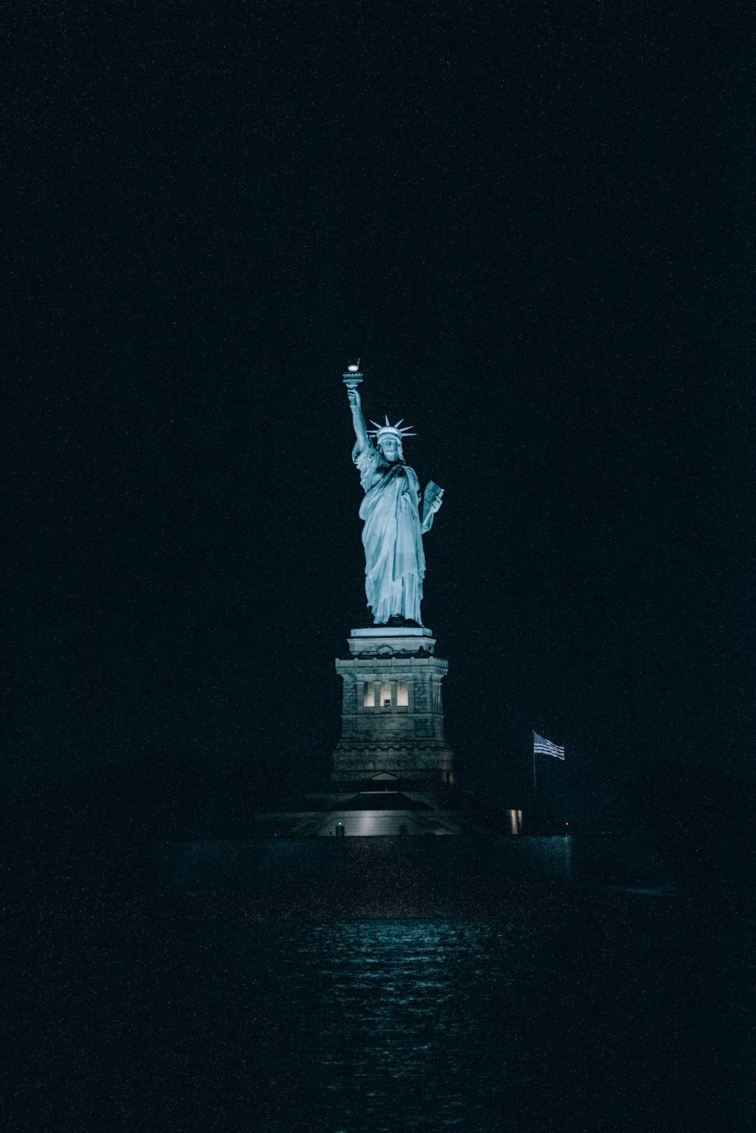 statue of liberty during night time