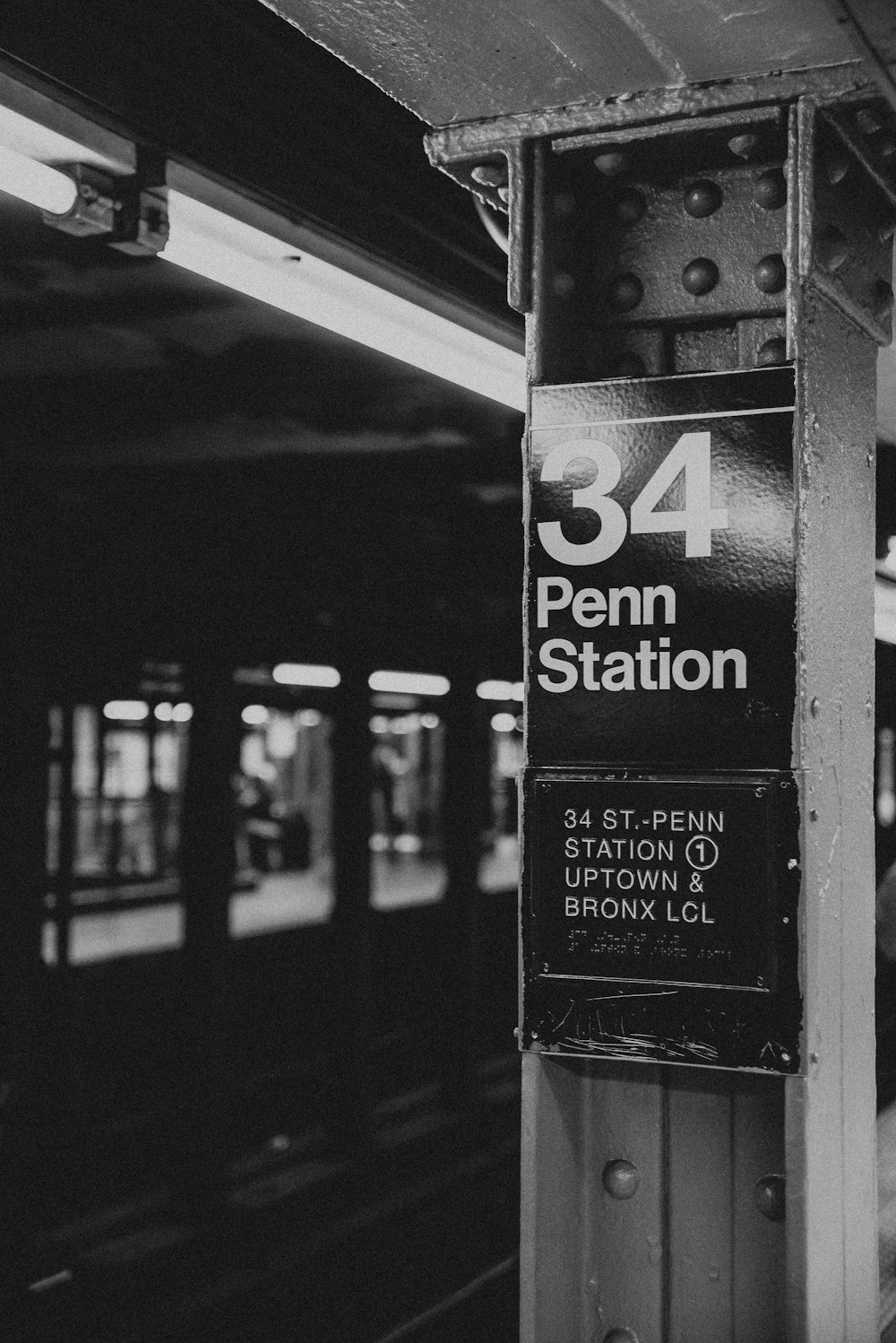 grayscale photo of a black and white signage