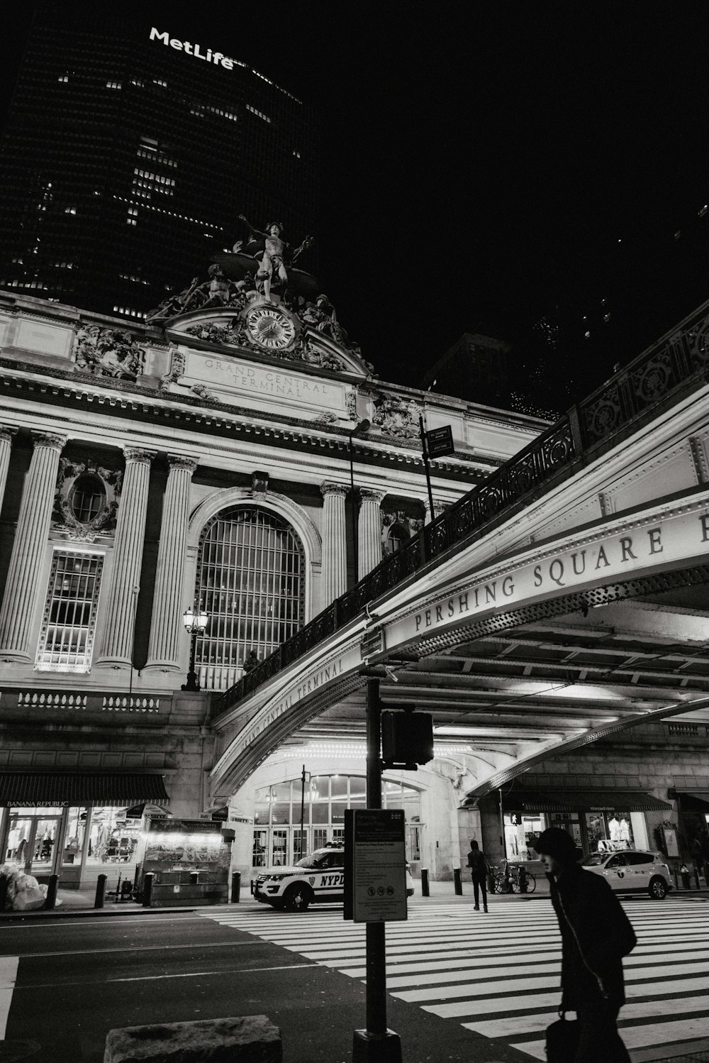 a black and white photo of a building at night