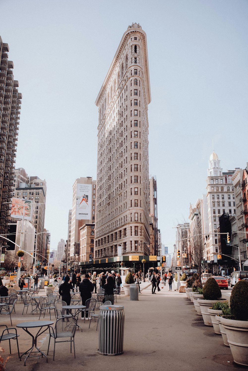 people walking on street near high rise buildings during daytime