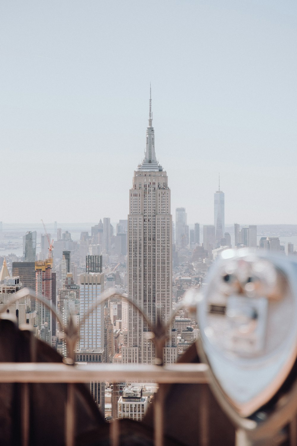 woman looking at the city buildings during daytime