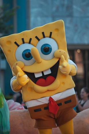 A cheerful illustration of SpongeBob SquarePants waving from Bikini Bottom.