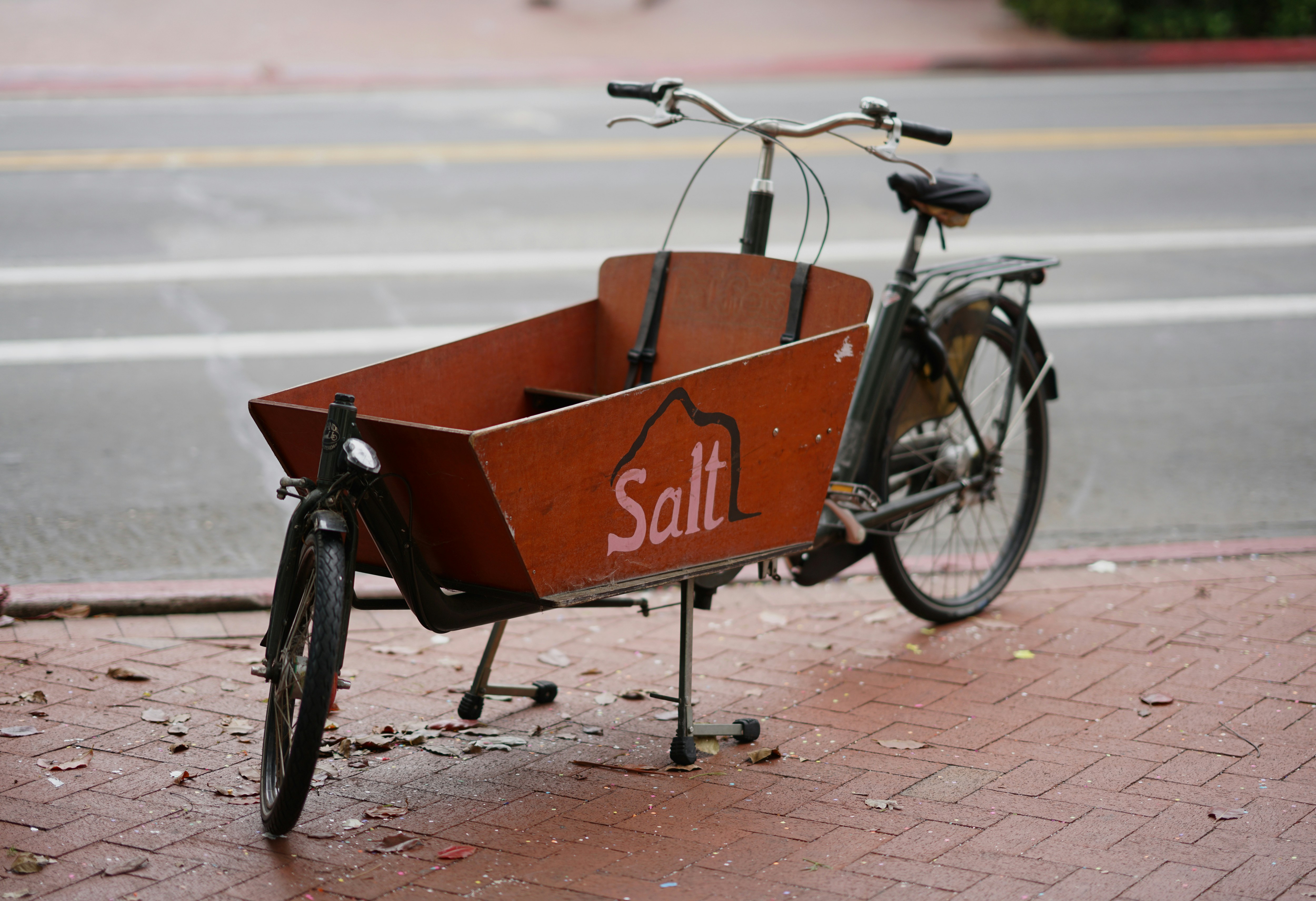 red and black bicycle with basket on top