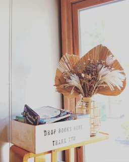 A delivery box from The Dream Library opened on a doorstep, revealing a carefully wrapped selection of children’s books.