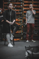 Rusty Axel reviewing lyrics on a notepad beside a vintage microphone.