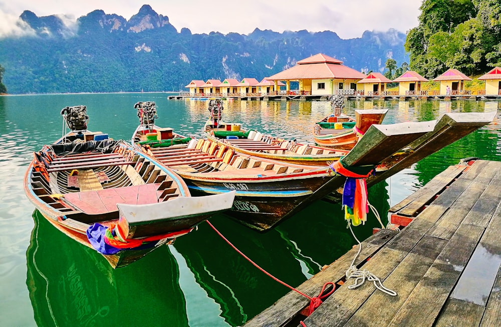 brown wooden boat on body of water during daytime