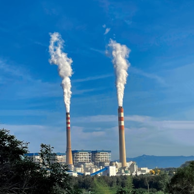 A factory with smoke stacks, showcasing advanced air filtration systems in operation.