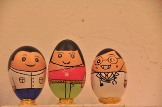 two brown and blue egg figurines
