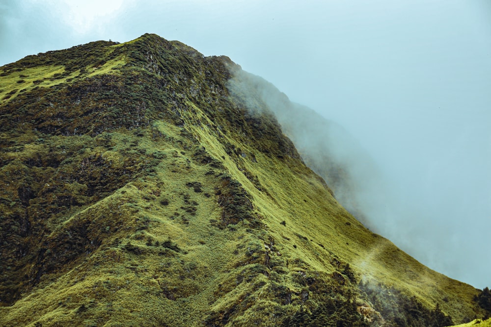 green mountain under white sky during daytime