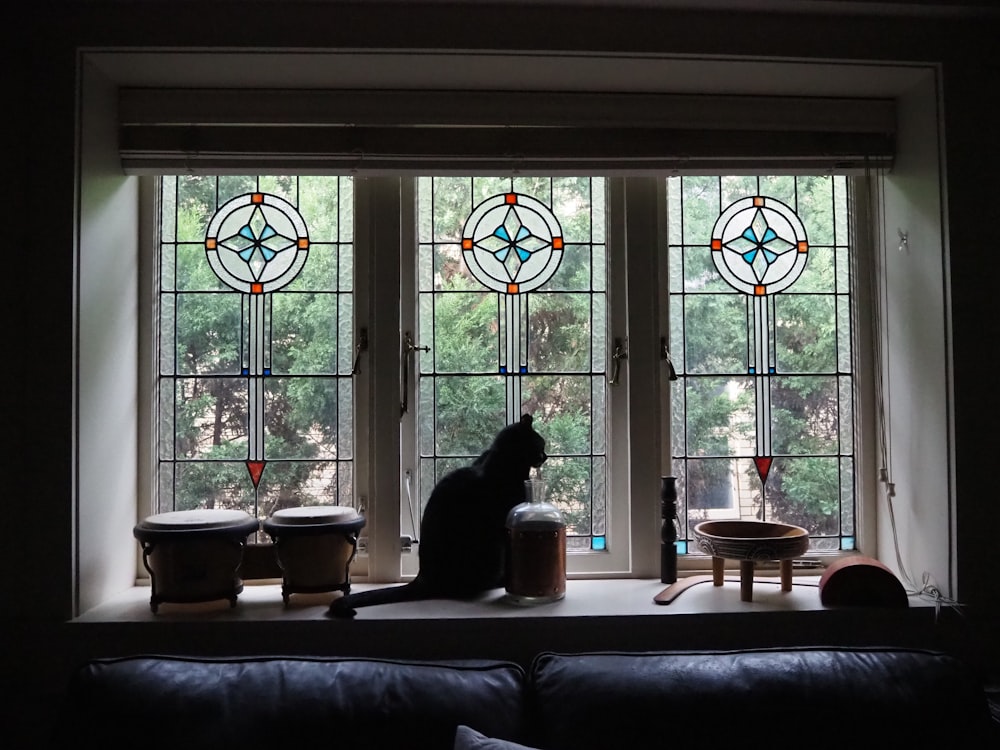 woman sitting on couch near window