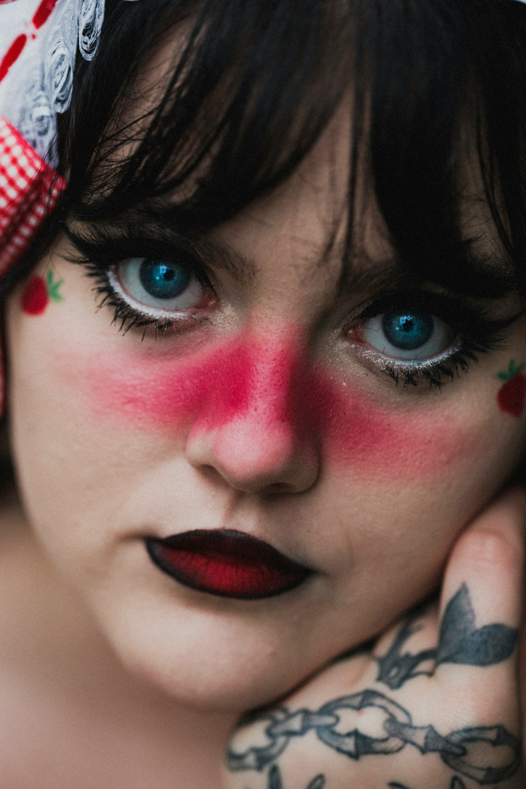 woman with blue eyes and red lipstick