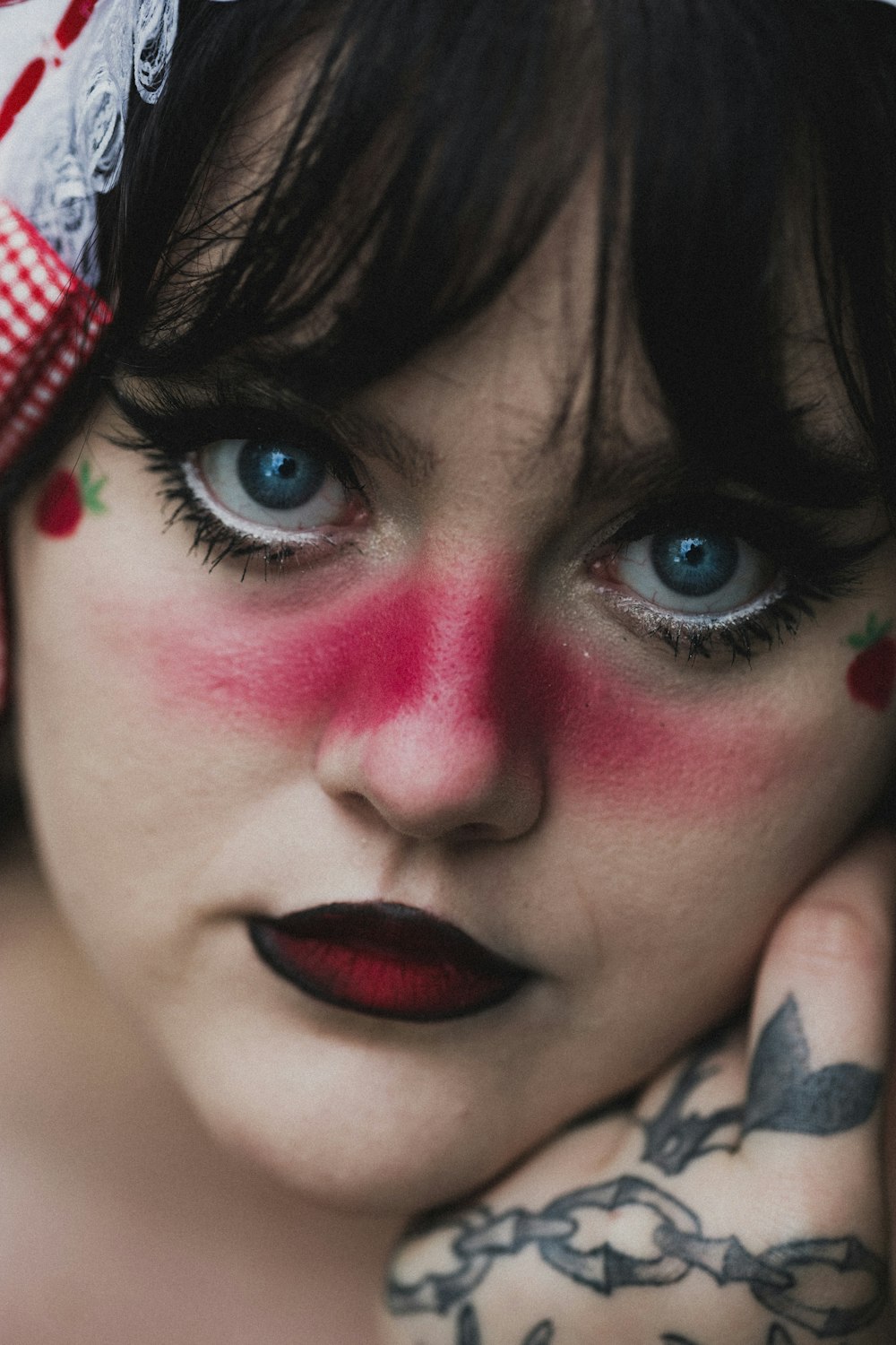 woman with blue eyes and red lipstick