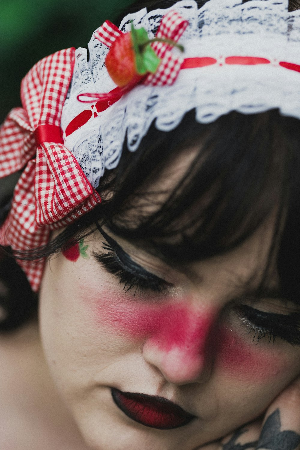woman with red and white floral headband