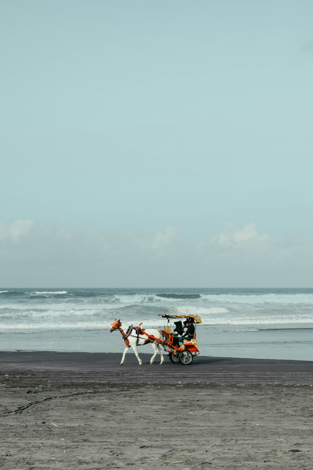 2 person riding on horse on beach during daytime