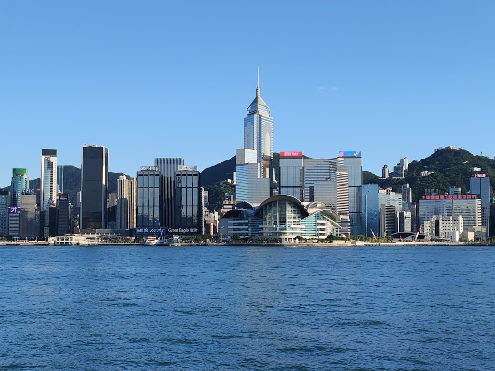 city skyline across body of water during daytime