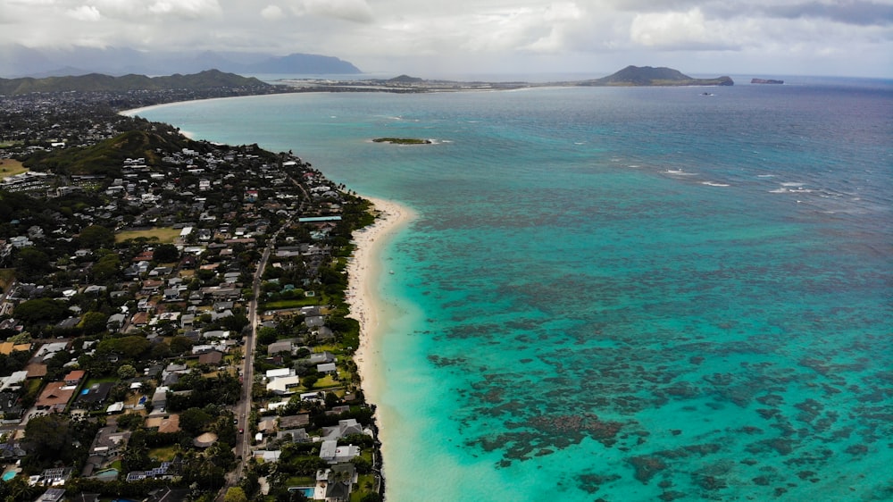 aerial view of city near body of water during daytime