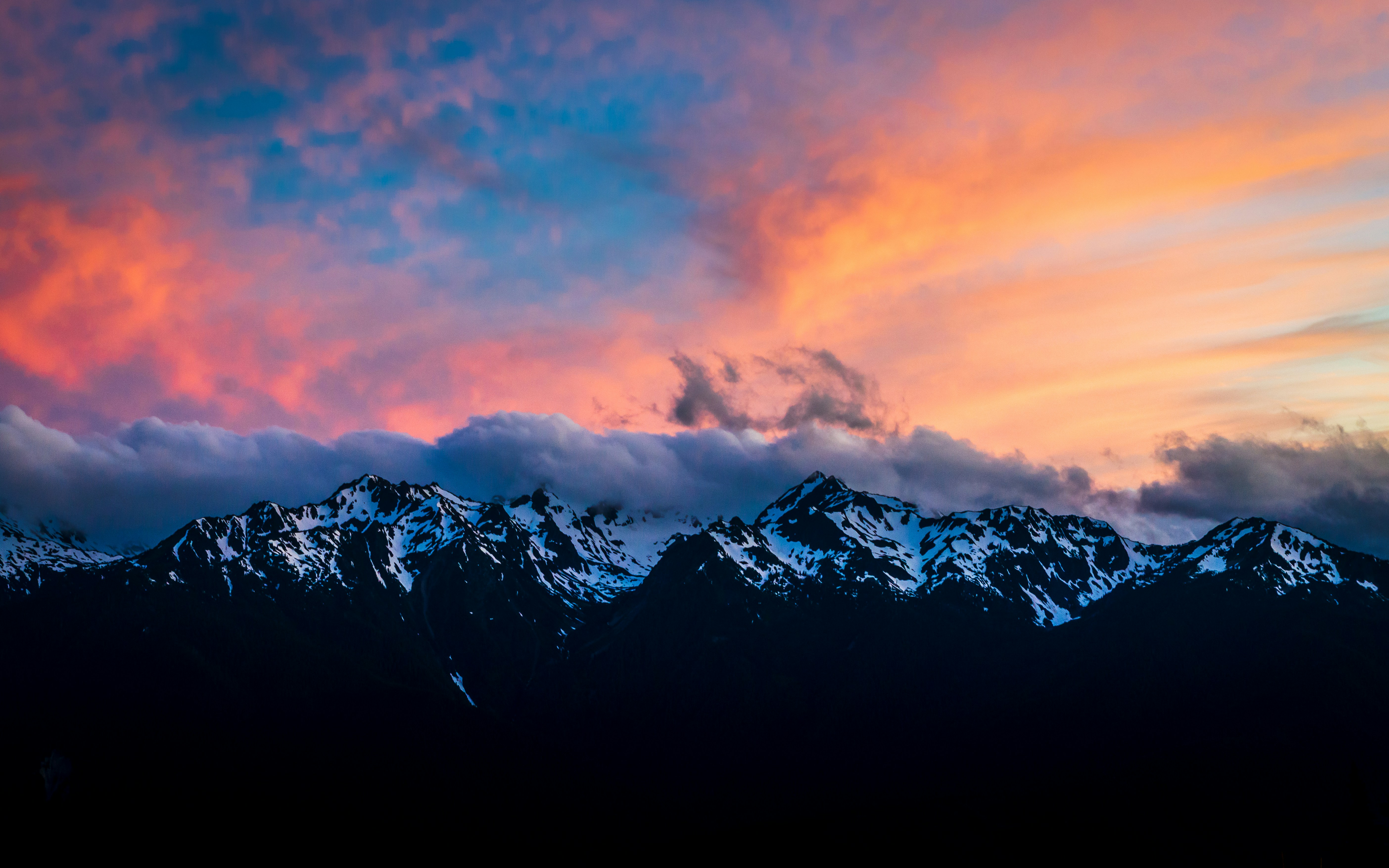 snow covered mountain under orange and blue sky, 