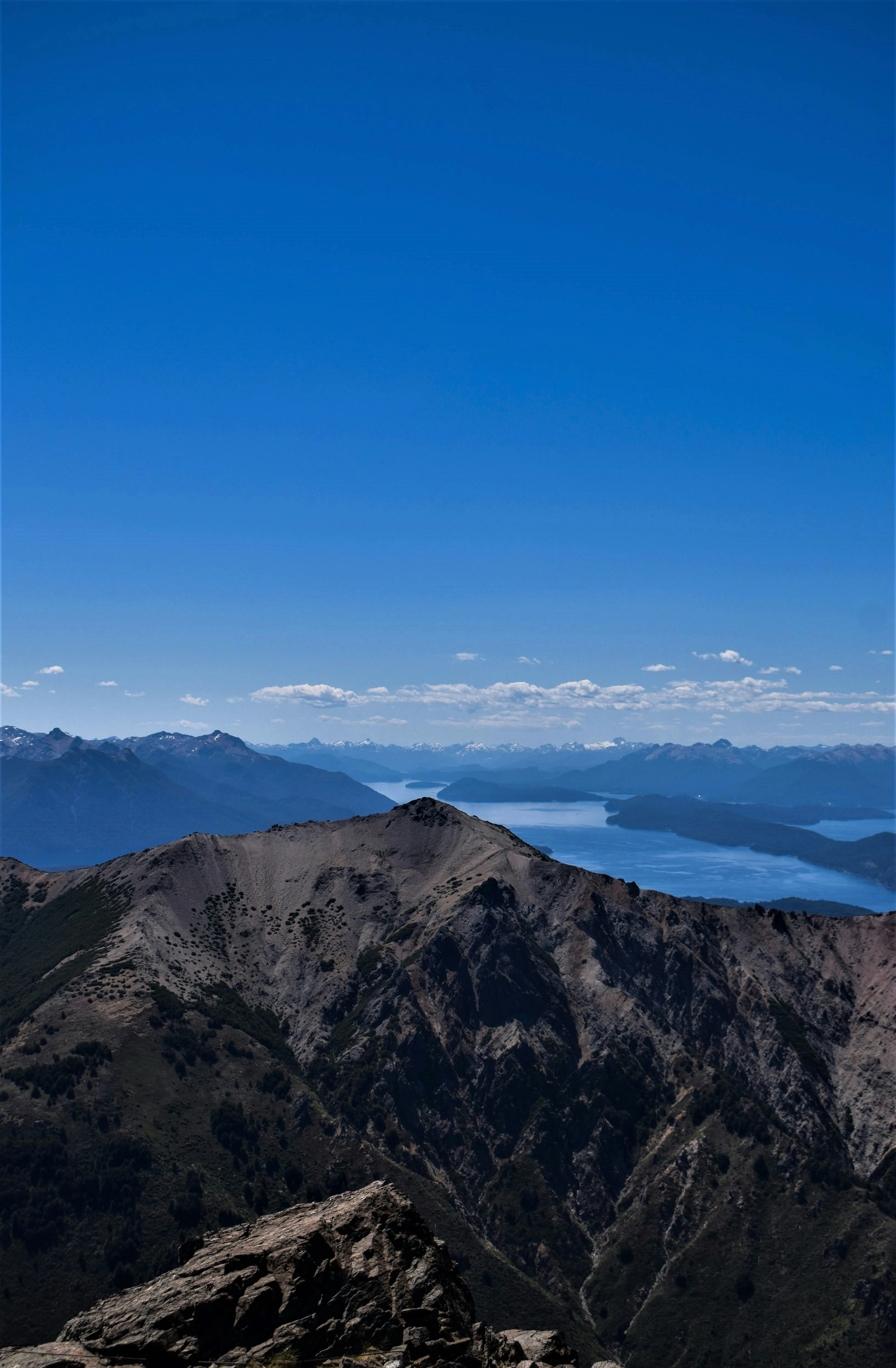brown and green mountains under blue sky during daytime