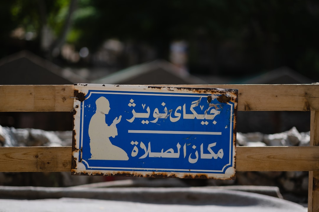 blue and white wooden signage