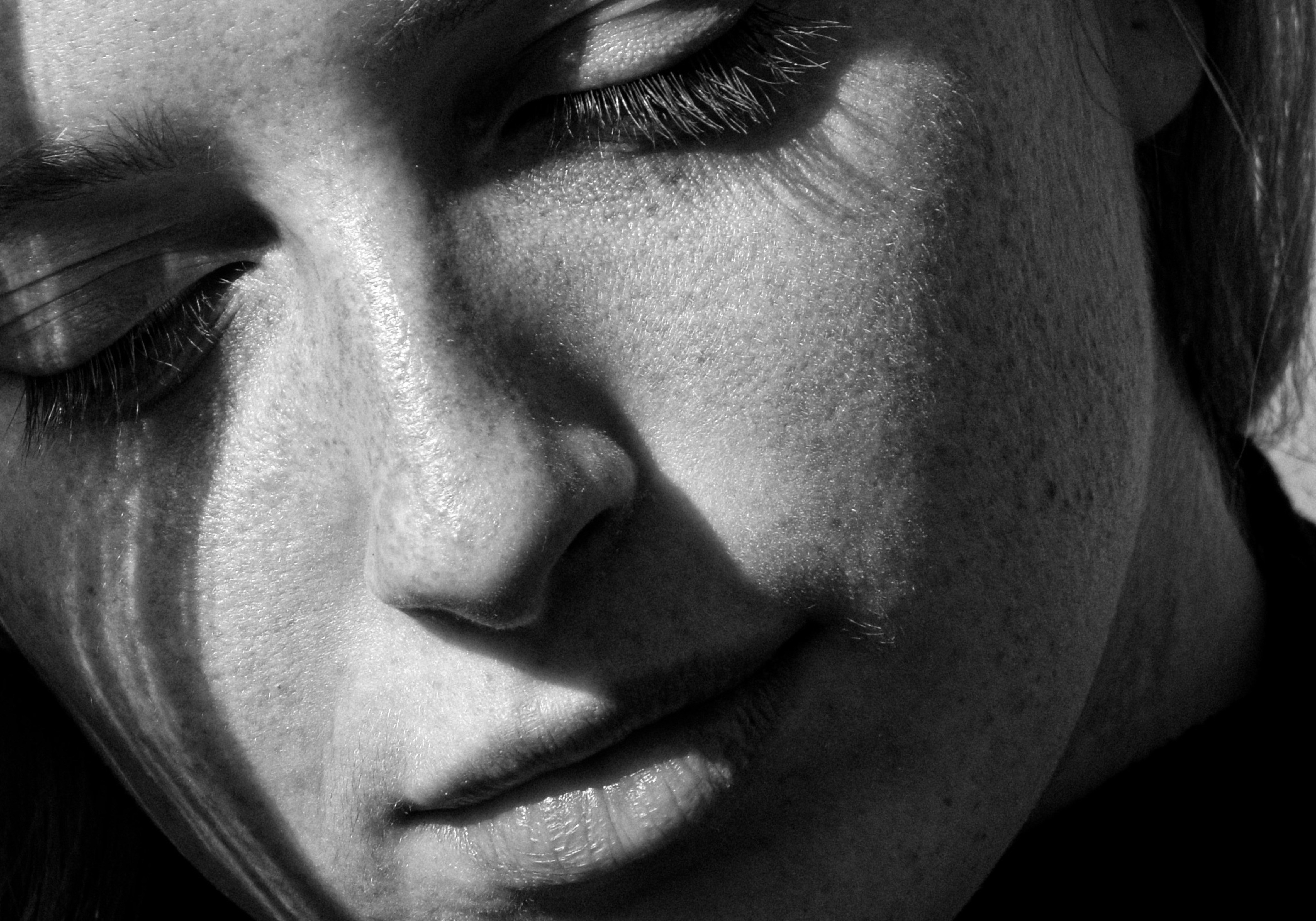 grayscale photo of womans face