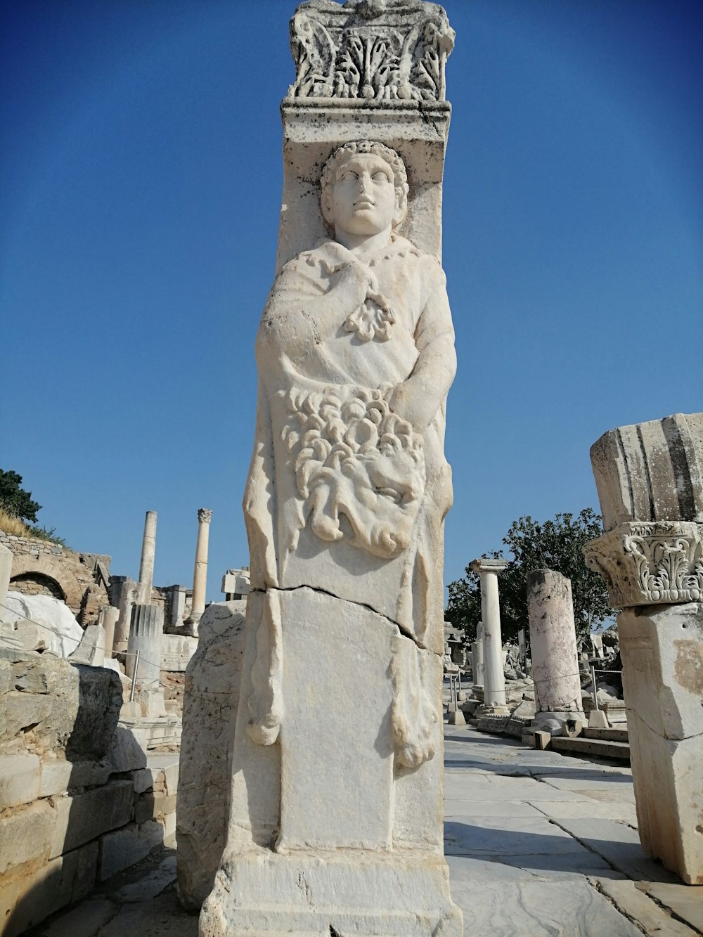 white concrete statue under blue sky during daytime