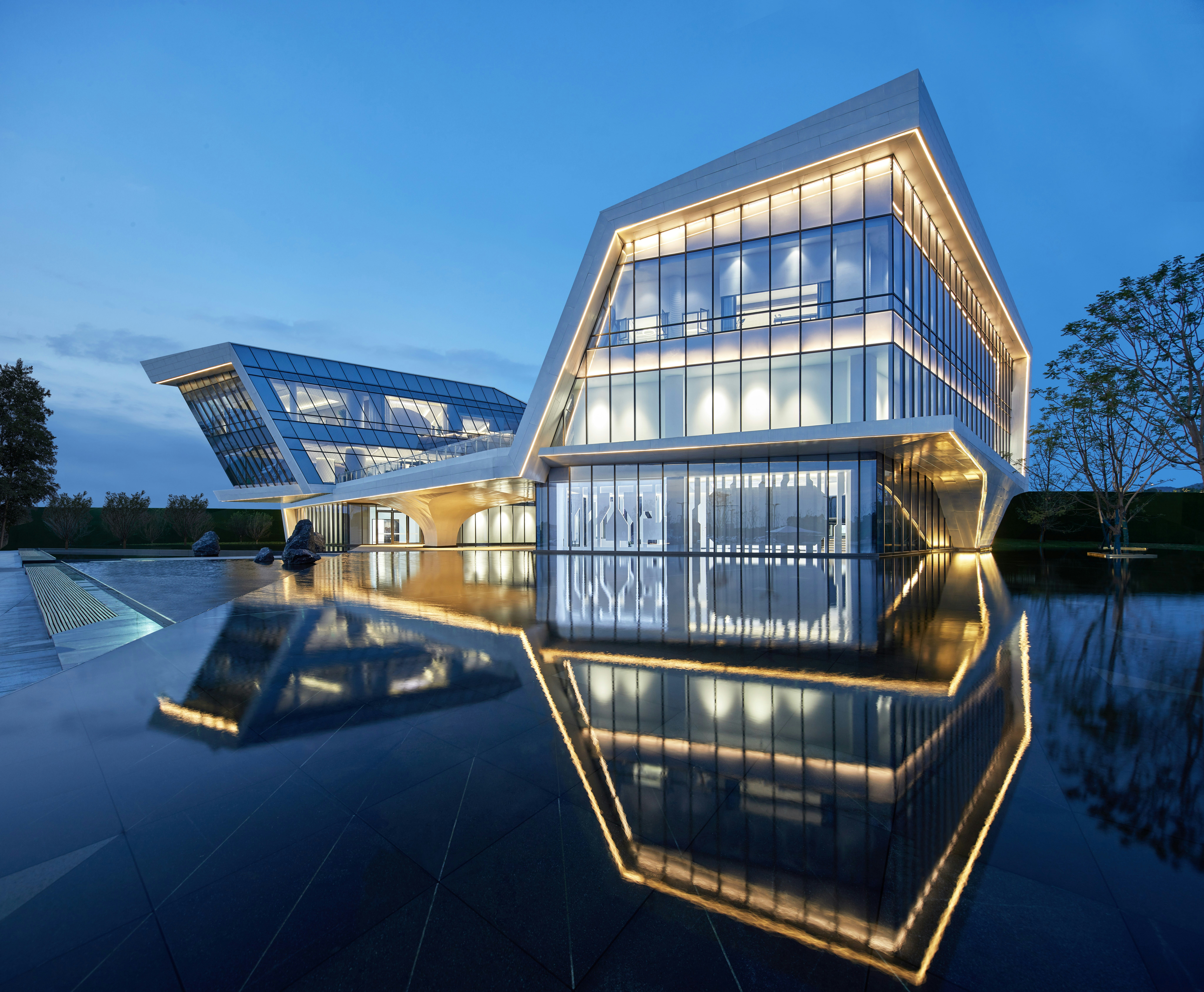 A design professional sketching a complex, glowing blueprint on a digital tablet in a modern, dark setting, representing the concept of architecting AI.