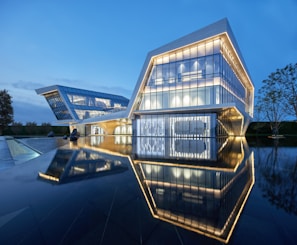 Evening view of a side office architecture project highlighting subtle lighting and minimalist landscaping.