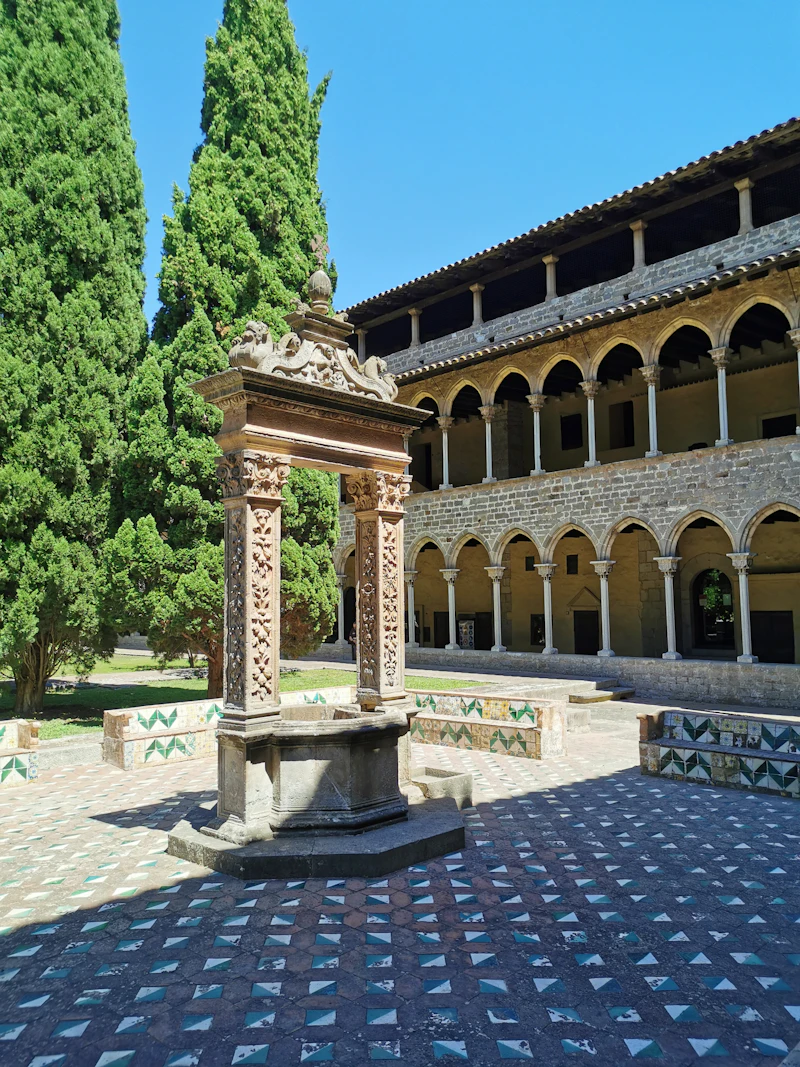 Stone building among trees in Pedralbes