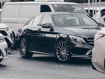 A diverse lineup of Midtown Rents vehicles including economy, SUV, and luxury cars parked side by side.