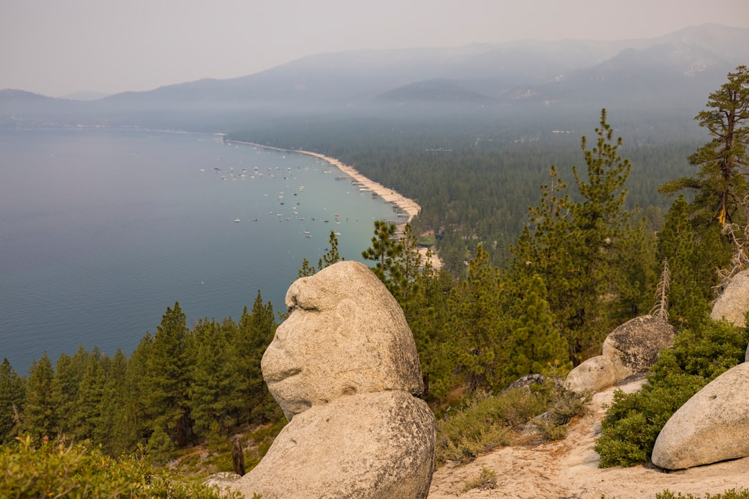 gray rock formation near body of water during daytime