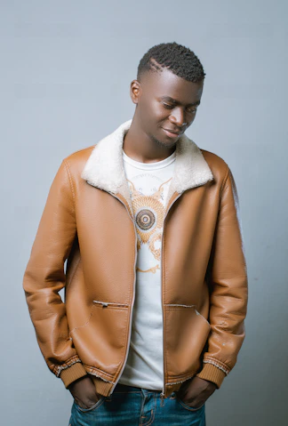 man in brown coat and black knit cap