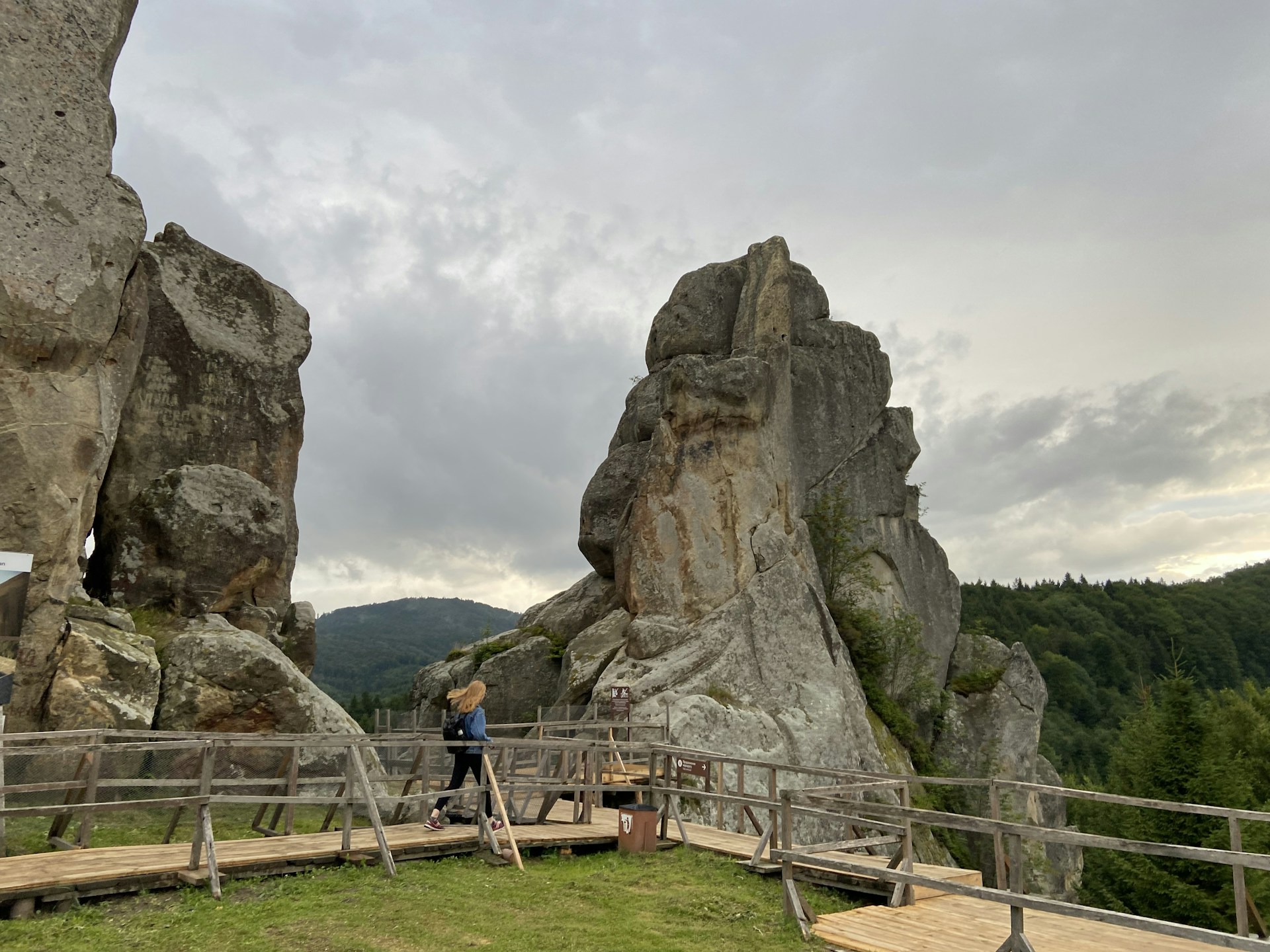woman wearing yellow long-sleeved dress under white clouds and blue sky during daytime