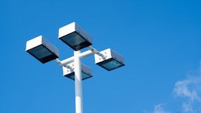 white and black street light under blue sky during daytime