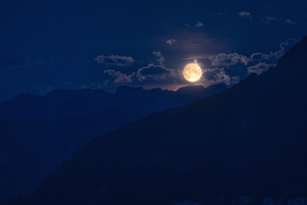 sun on clouds over mountain