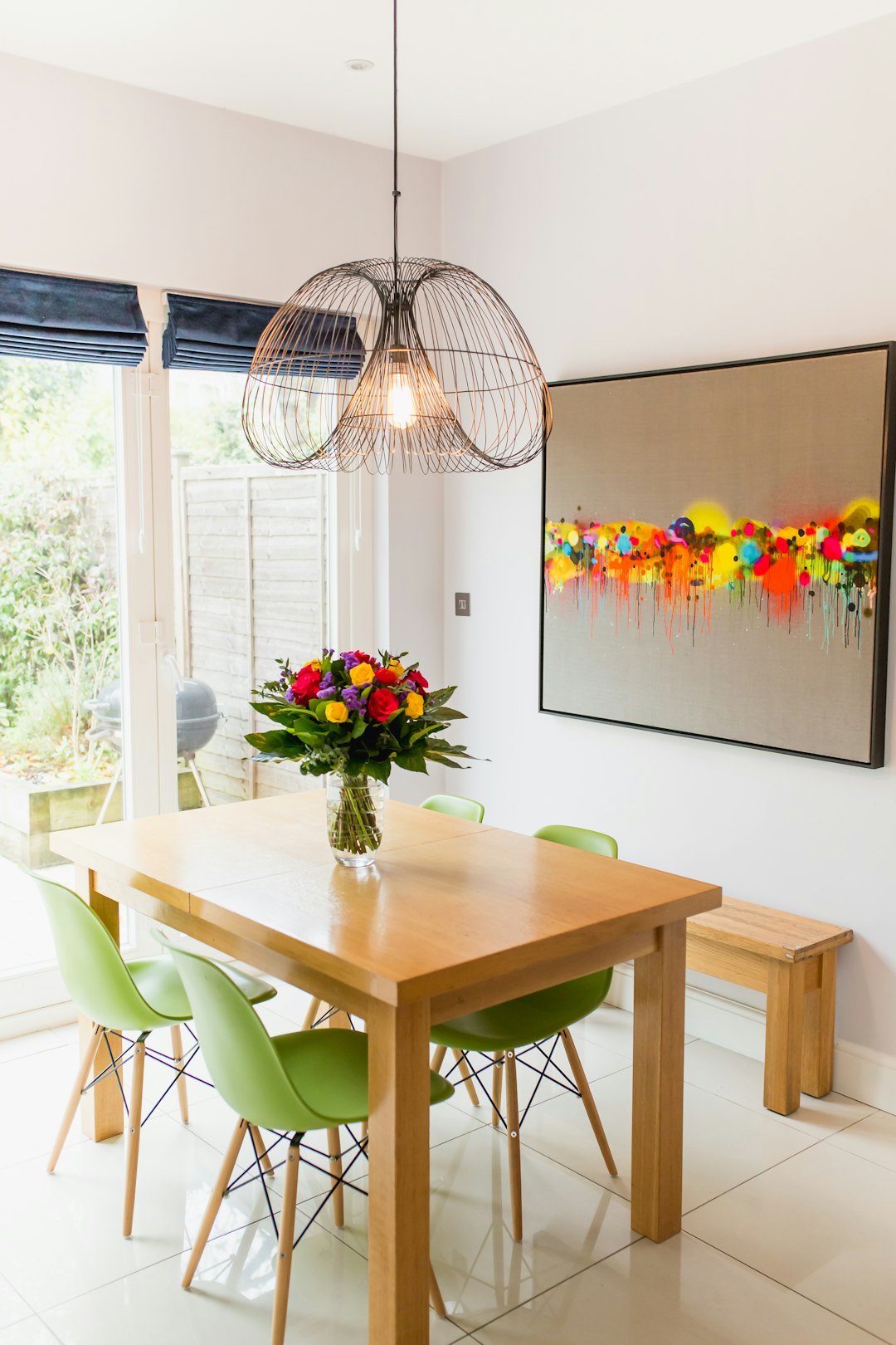 red and yellow flowers on brown wooden table