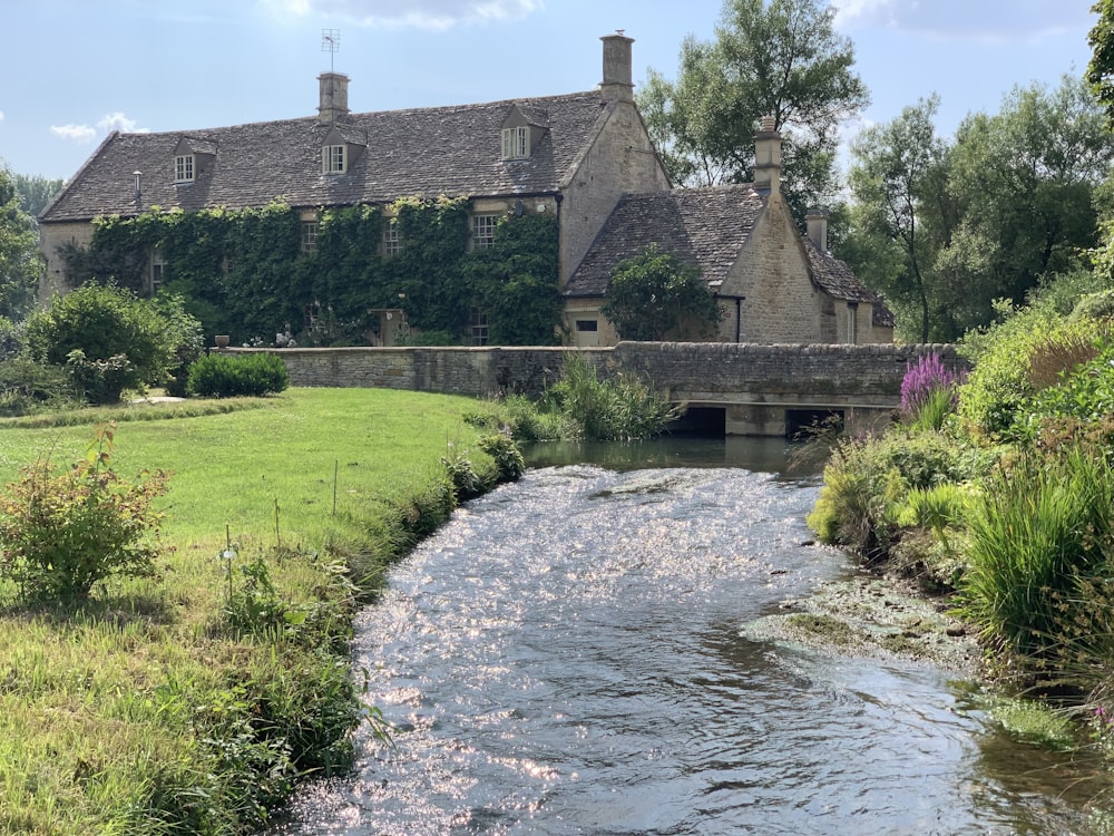 brown brick house near river