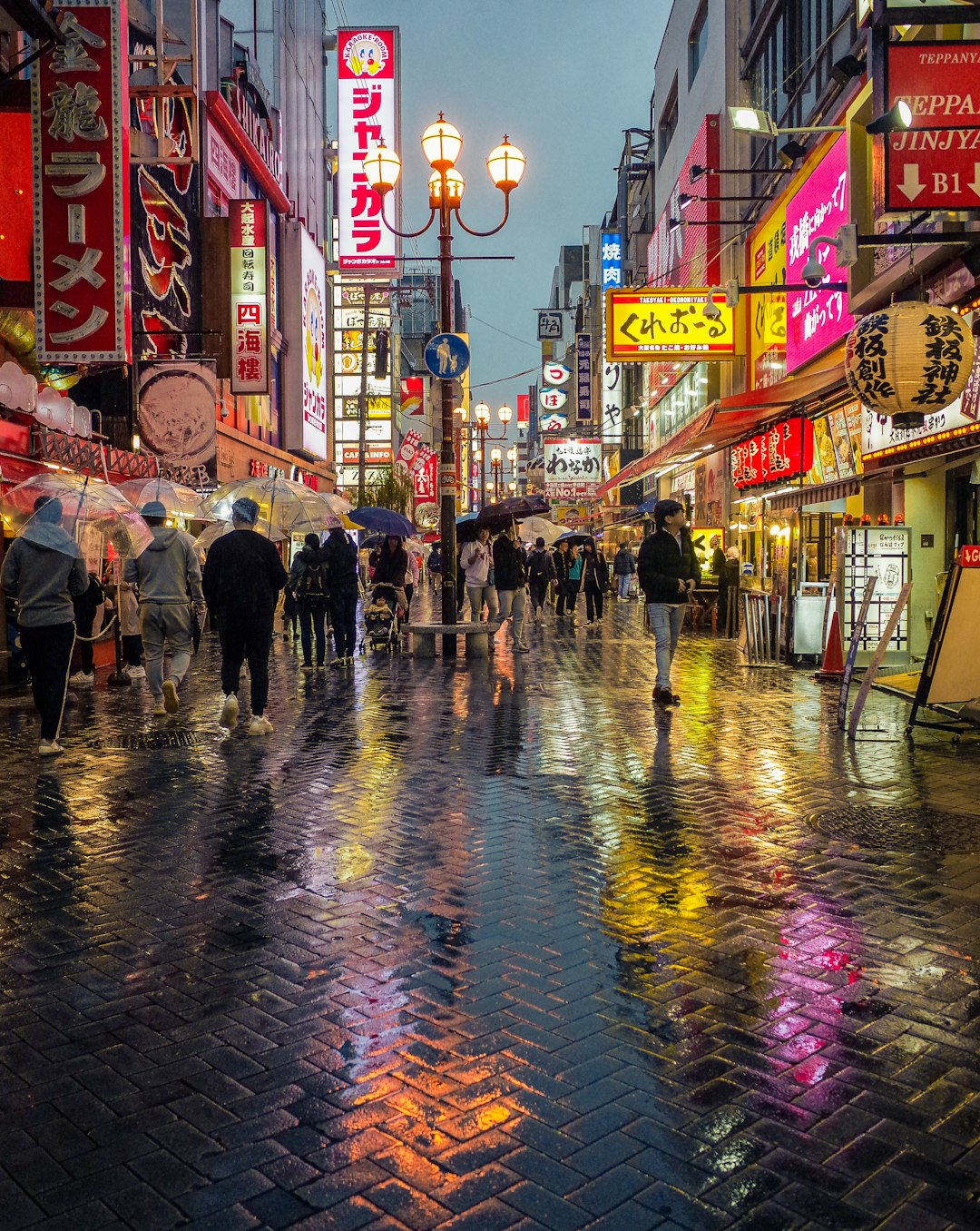 people walking on street during night time